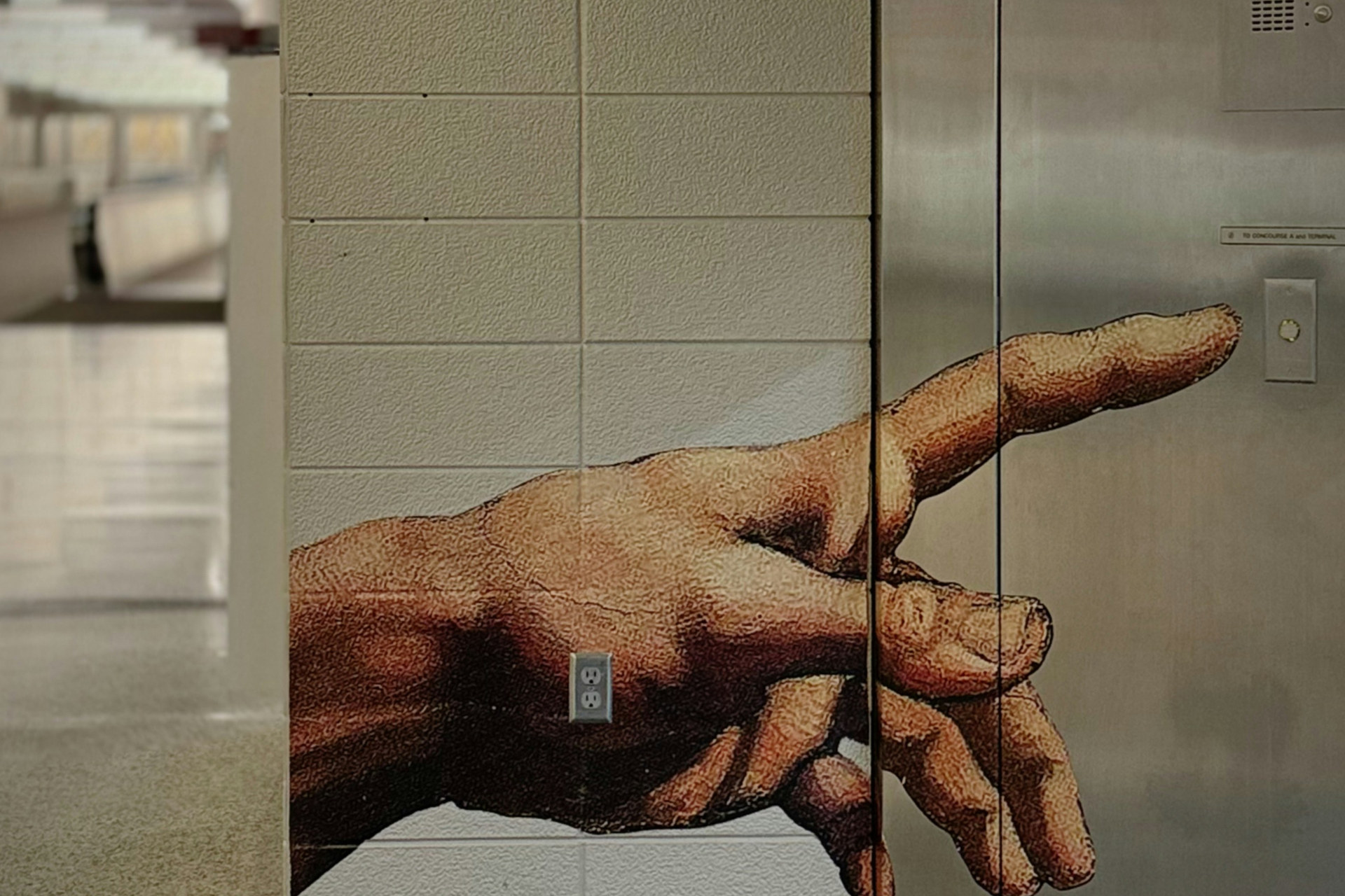 Pointing hand mural